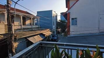 Family Quadruple Room, City View | Property grounds