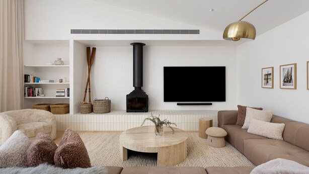 A modern living room with a fireplace, a flat-screen TV, and a sofa. - Ms Dana Bridgewater - Blairgorwie (Blairgowrie)