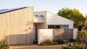 A modern house with a large wooden garage, a sloped roof, and a small garden area. - Ms Dana Bridgewater - Blairgorwie (Blairgowrie)