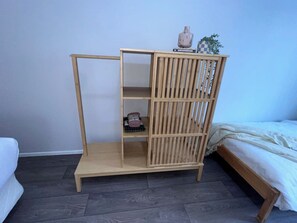A wooden wardrobe with a shelf, a hanging section, and a small table on top. - u2-Cute Fresh Unit|Quiet Centre|NewAC|SmartTV (Norman Park)