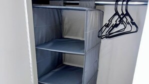 A closet with multiple shelves and hanging space. - u4-Traditional Unit-Quiet Close CBD-AirConSmartTV (Norman Park)