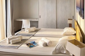A hotel room with a bed, pillows, a chair, a desk, and a magazine. - Villa Garden House GH06, Pool & Holidays, 2 Min To Beach, Mauricius, Mauritius (Mauricius)