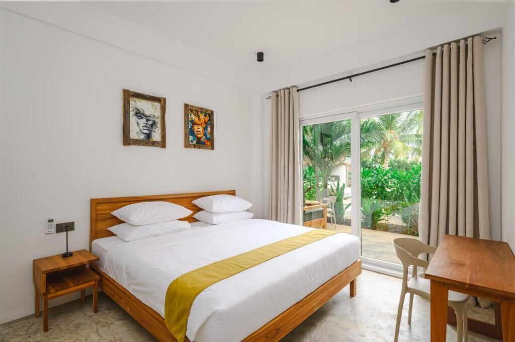 Standard Apartment, Pool View | In-room safe, desk, laptop workspace, iron/ironing board