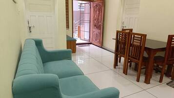 Luxury Cottage | Living area | 23-inch LED TV with cable channels