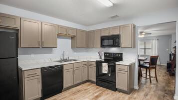 Coffee/tea maker, fridge, microwave, oven