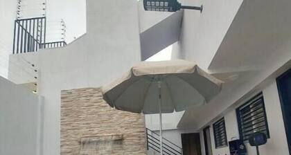 S1 Beautiful private suite with balcony, kitchen, TV, and bathroom; king-size bed