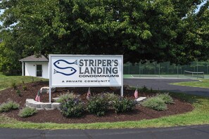 A sign for Striper's Landing Condominiums, indicating it is a private community.