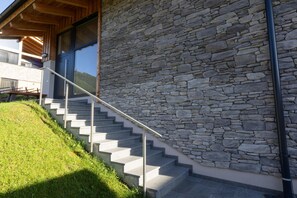 A staircase leading to a building with a stone facade. - Ski-in/ski-out chalet with beautiful view (St. Lambrecht)