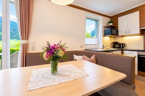 A modern kitchen with a built-in microwave, a coffee maker, and a sink. - Apartment in Mittersill with terrace (Mittersill)