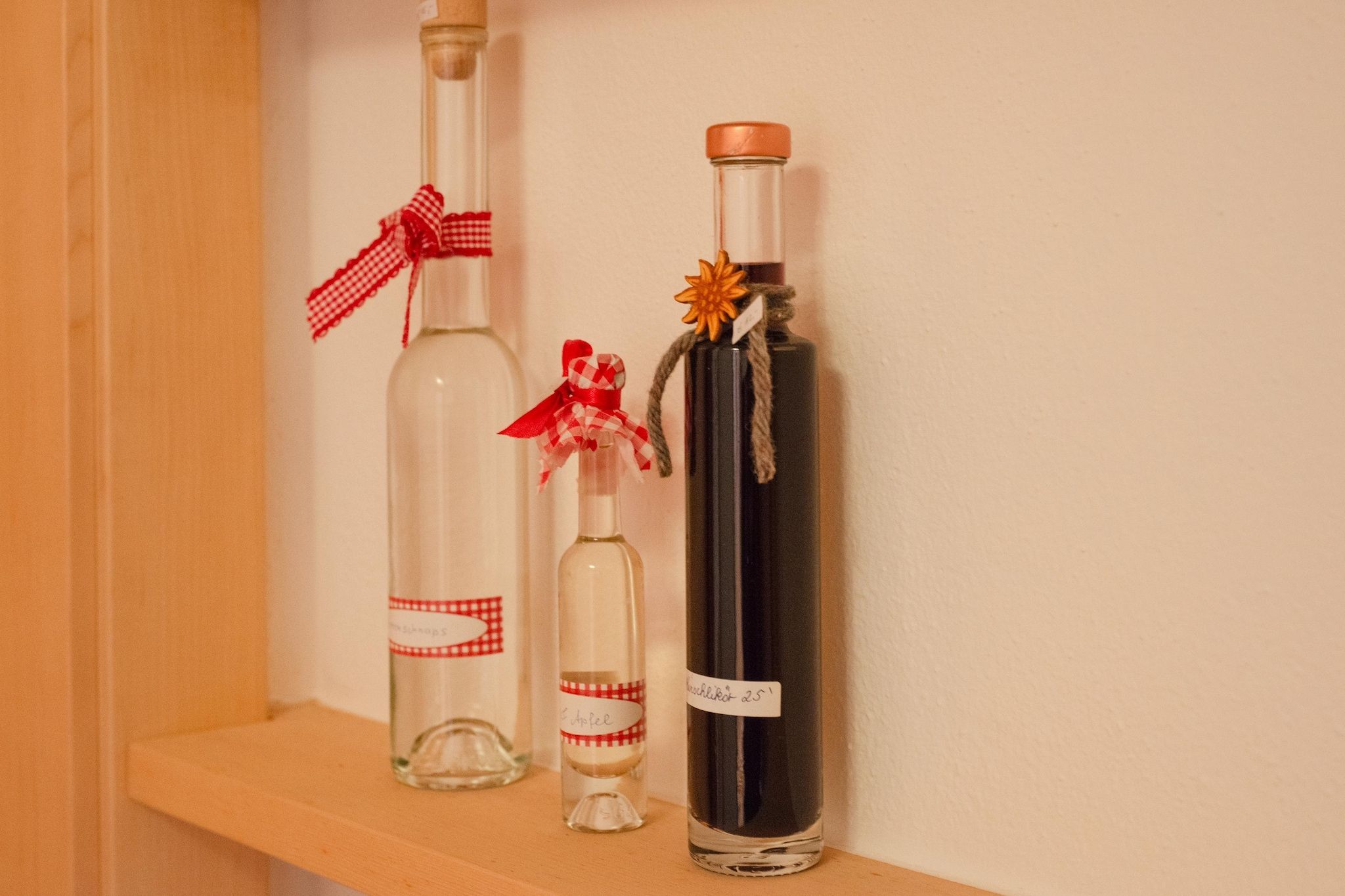 Three bottles on a shelf.