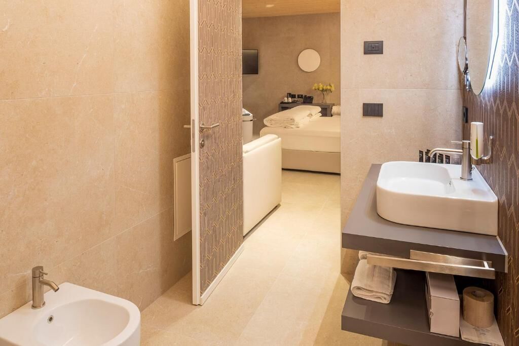 Junior Suite, Pool View | Bathroom | Separate tub and shower, hair dryer, towels, soap