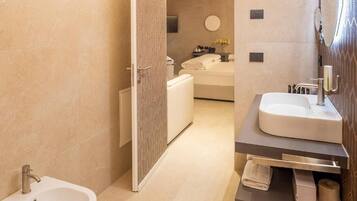 Junior Suite, Pool View | Bathroom | Separate tub and shower, hair dryer, towels, soap