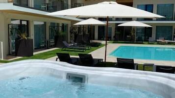 Seasonal outdoor pool, pool umbrellas, sun loungers