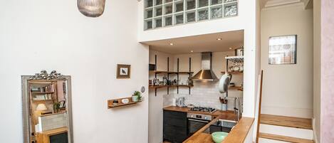 Fridge, oven, toaster, dining tables
