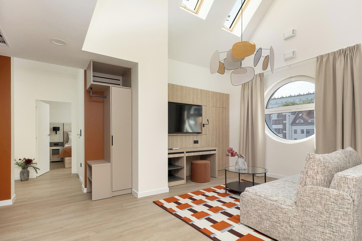 Deluxe Suite, City View | In-room safe, desk, laptop workspace, blackout curtains