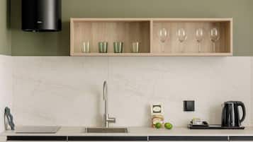Deluxe Suite, City View | Private kitchen | Espresso maker, full-size fridge, stovetop, dishwasher