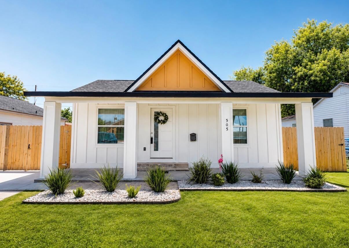 A single-story house with a front porch, a mailbox, and a number '5' on the front wall.