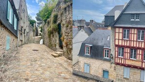 Una estrecha calle adoquinada bordeada por edificios históricos de arquitectura tradicional.