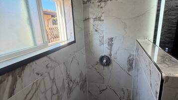 Shower, towels, soap, toilet paper
