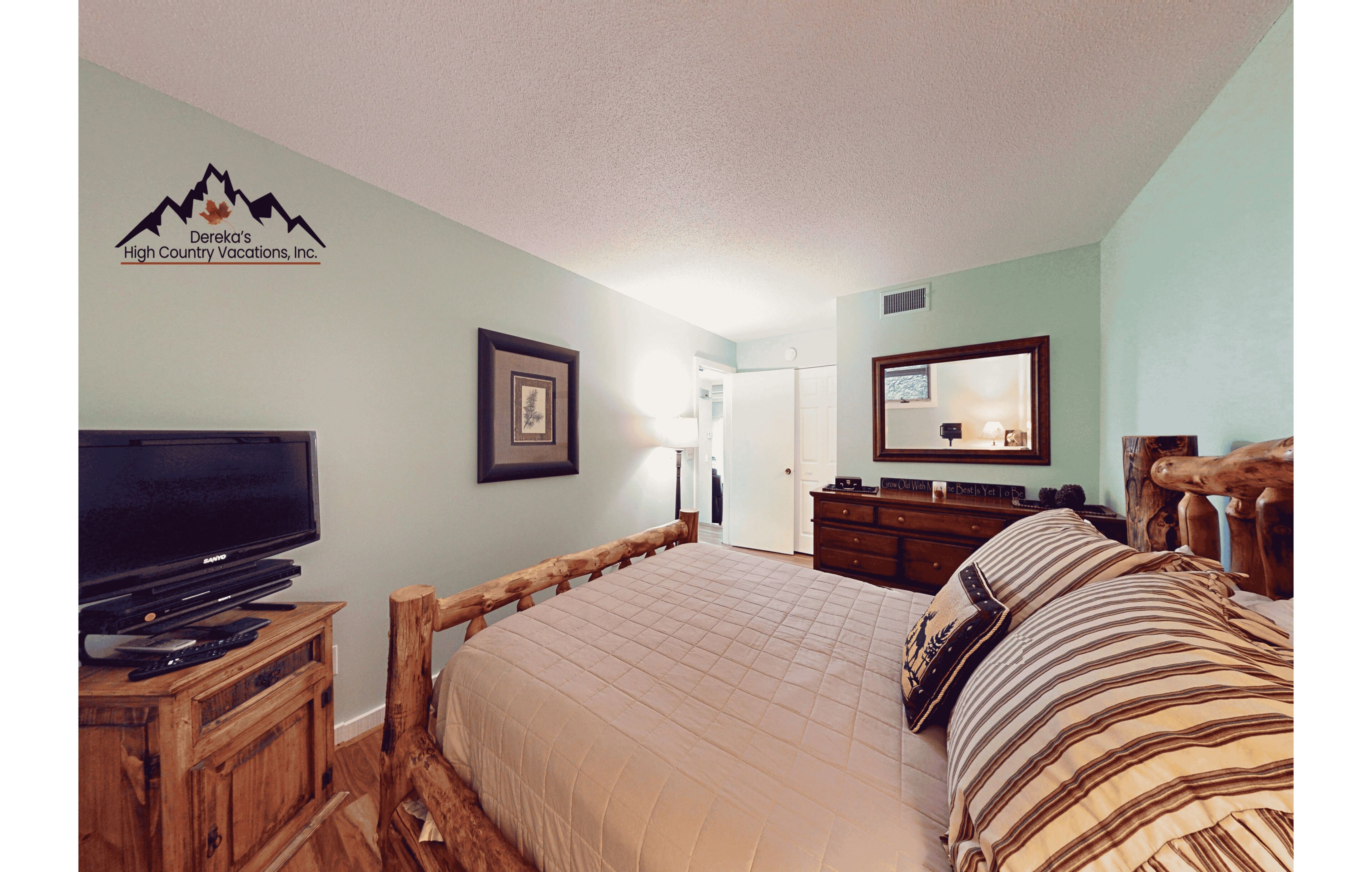 Your mountain retreat awaits with a rustic log bed, cozy linens, and warm wood furnishings. Unwind with your favorite shows or drift off to peaceful alpine dreams.