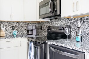 Coffee/tea maker, fridge, microwave, oven