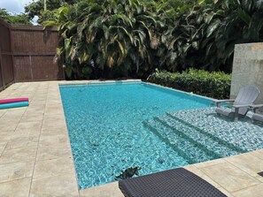 A rectangular swimming pool with clear blue water, surrounded by a tiled deck. - Private, Luxury Villa with Heated Pool    MI CASA ES TU CASA (San Lorenzo)