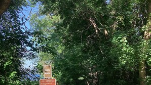 A signpost with information about Birch Beach, including a map and rules for visitors. - Vintage 2-bedroom+ cabin/summerhome; 5 minute walk to Lake beach (White Bear Lake)