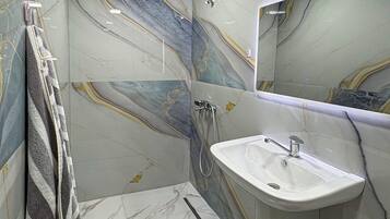 Shower, hair dryer, towels, soap