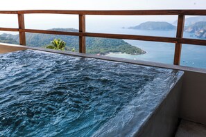 A hot tub with a view of a coastal landscape. - Ocean View Two-Bedroom Villa at Cerro del Vigia (Zihuatanejo)