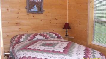 Tabla de planchar con plancha, internet y ropa de cama