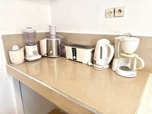 A kitchen counter with a blender, juicer, food processor, toaster, kettle, and coffee maker. - Family villa with no neighbors directly across the street, 5 minutes from the beach - Sidi Bouzid (Sidi Bouzid)