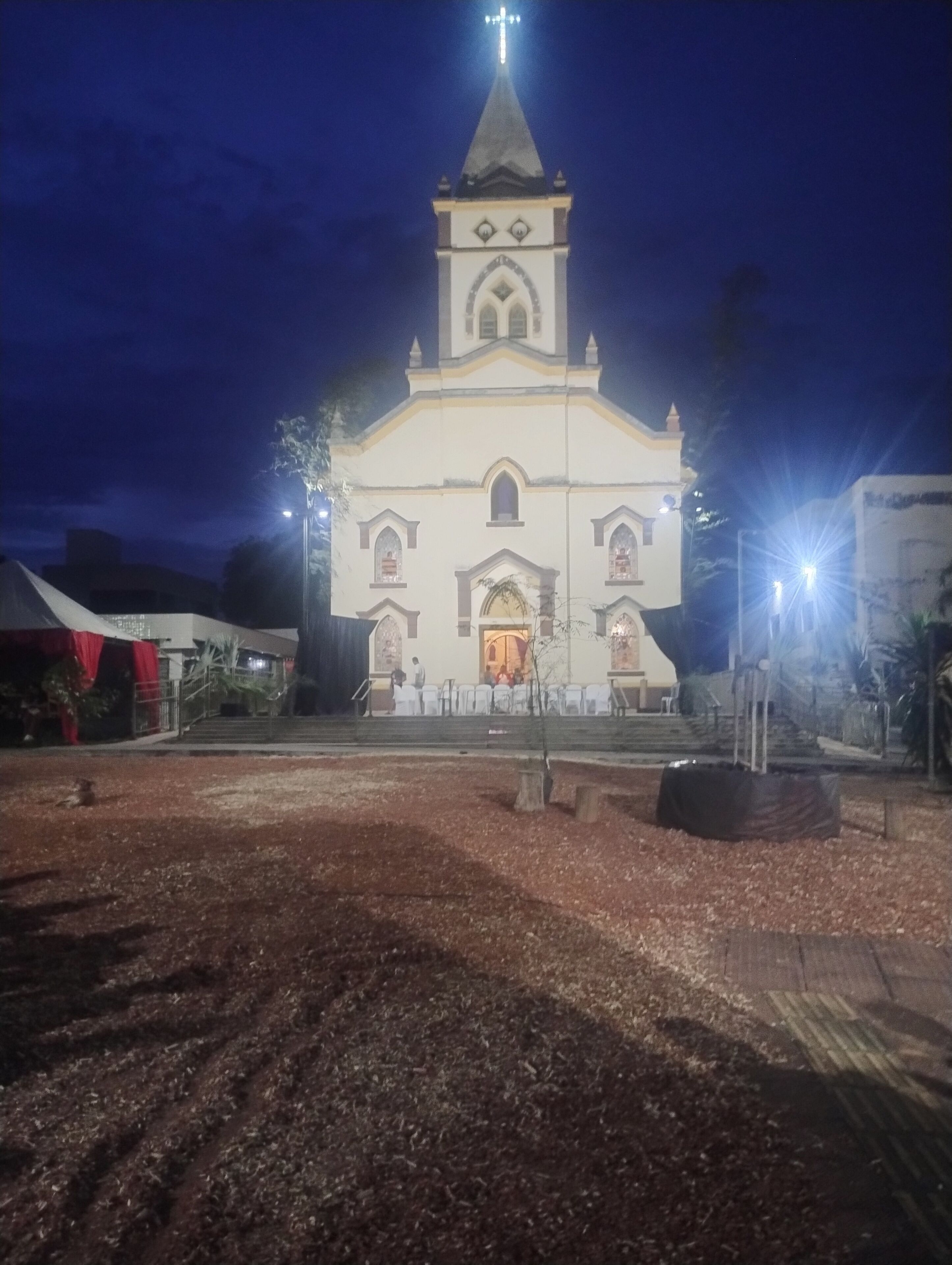 A church with a prominent bell tower and a large entrance.
