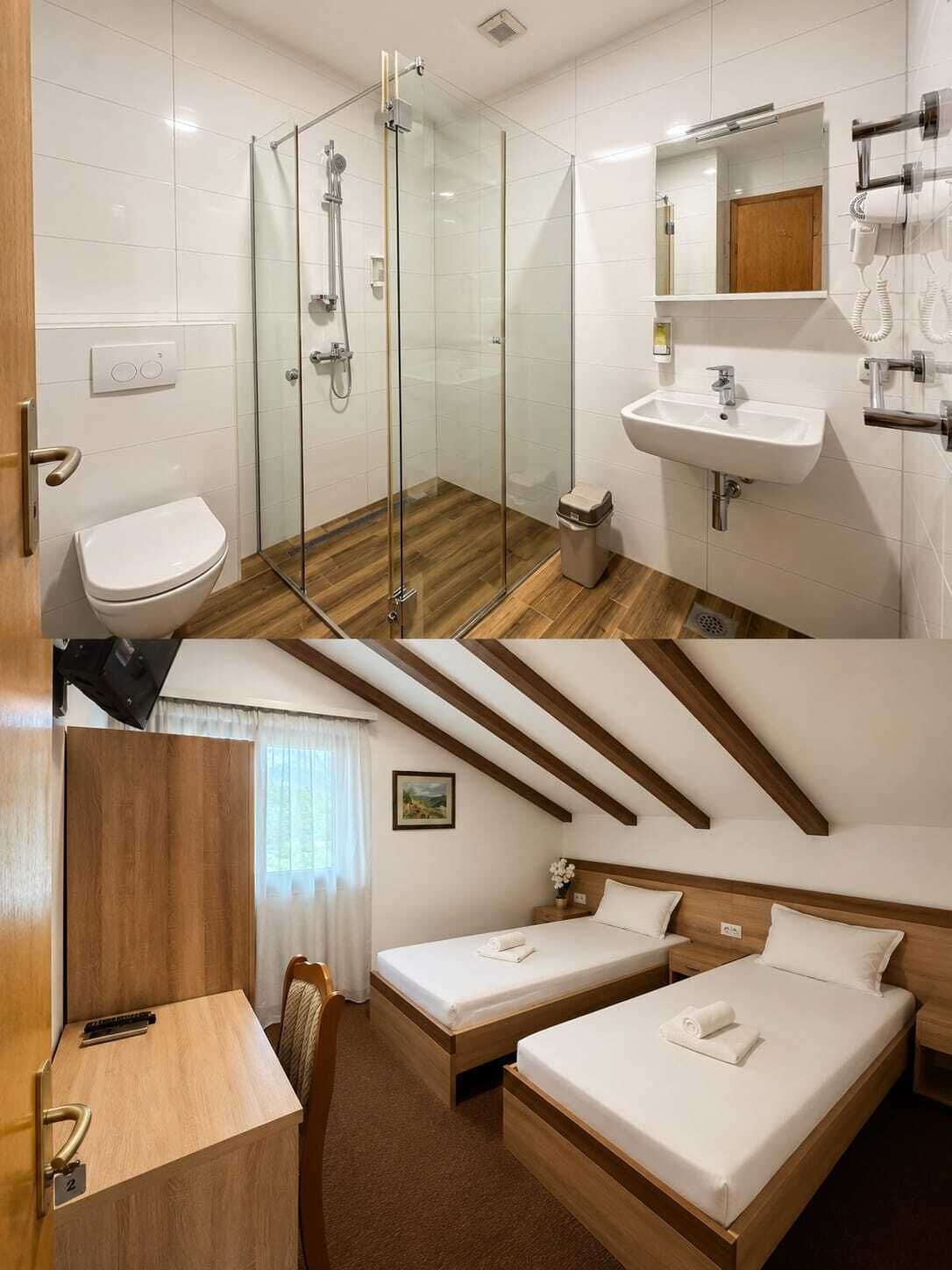A hotel room with a shower, toilet, sink, and two beds.