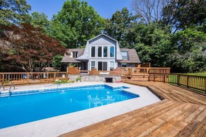 A house with a swimming pool, wooden deck, and a fenced backyard. - Experience Stunning Scenic Views! (Knoxville)
