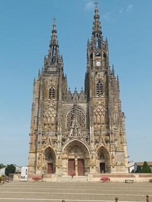 A large, ornate cathedral with twin spires and intricate stonework.