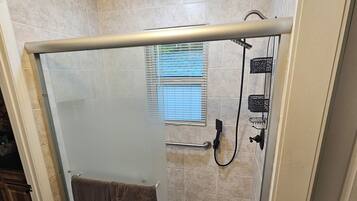 Shower, hair dryer, towels, soap