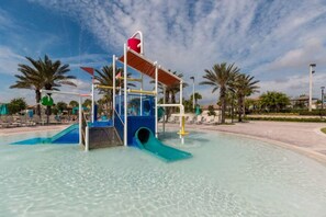 A water play area with slides and a small bridge structure. - Elegant Villa in ChampionsGate | Near Disney (Davenport)