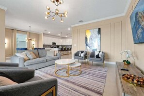 Gather, relax, and make unforgettable memories in our elegant and spacious living room, thoughtfully designed with comfort and style in mind. - Elegant Villa in ChampionsGate | Near Disney (Davenport)