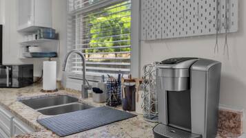 Coffee/tea maker, fridge, microwave, oven