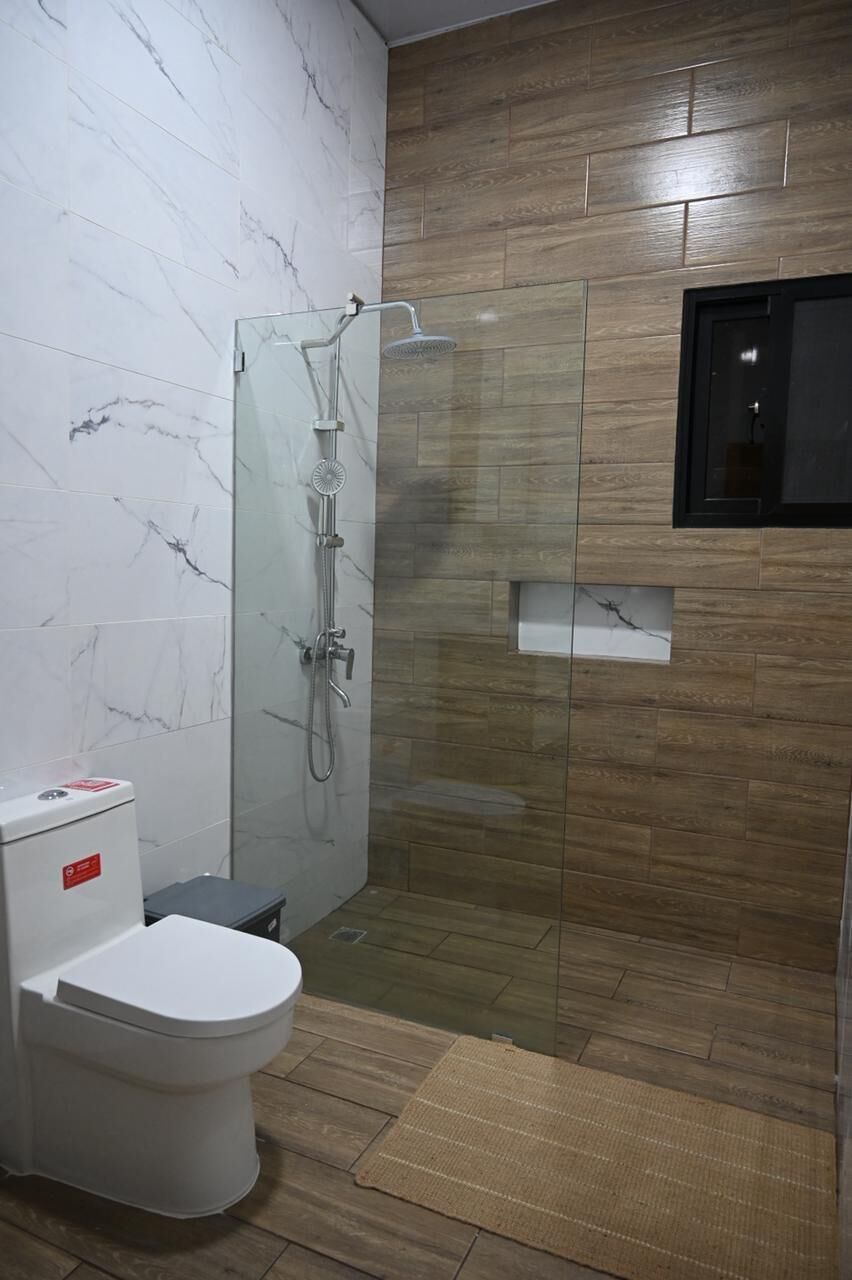 Shower, towels, soap, toilet paper