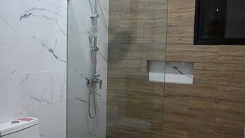 Shower, towels, soap, toilet paper