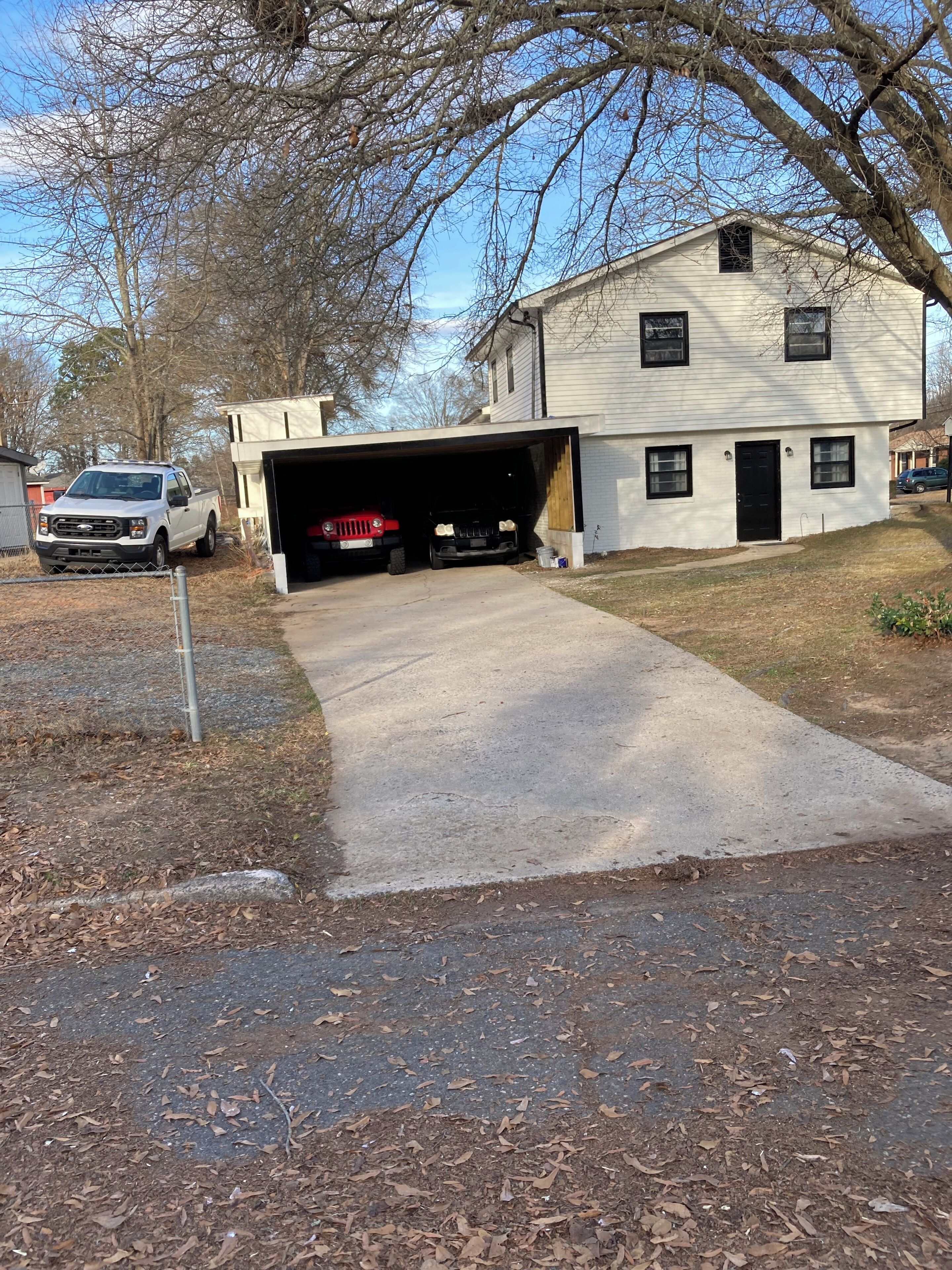 A two-story building with a garage.
