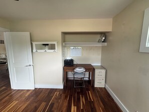 A small office space with a desk, chair, filing cabinet, and a white door. - Gorgeous Jewel of West Side Rapid City, in the heart of where you want to be! (Rapid City)