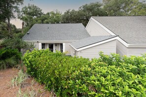 A residential property with a grey roof, white exterior walls, and a number '431' on the side. - Double Bogey by Sandpiper | Near Beach (Seabrook Island)