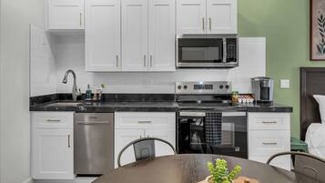 Coffee/tea maker, fridge, microwave, oven