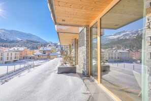 A modern building with large windows and a view of a snowy mountain landscape. - Residenza Castanea 003 San Bernardino Alpine Apartments, San Bernardino, Switzerland (San Bernardino)
