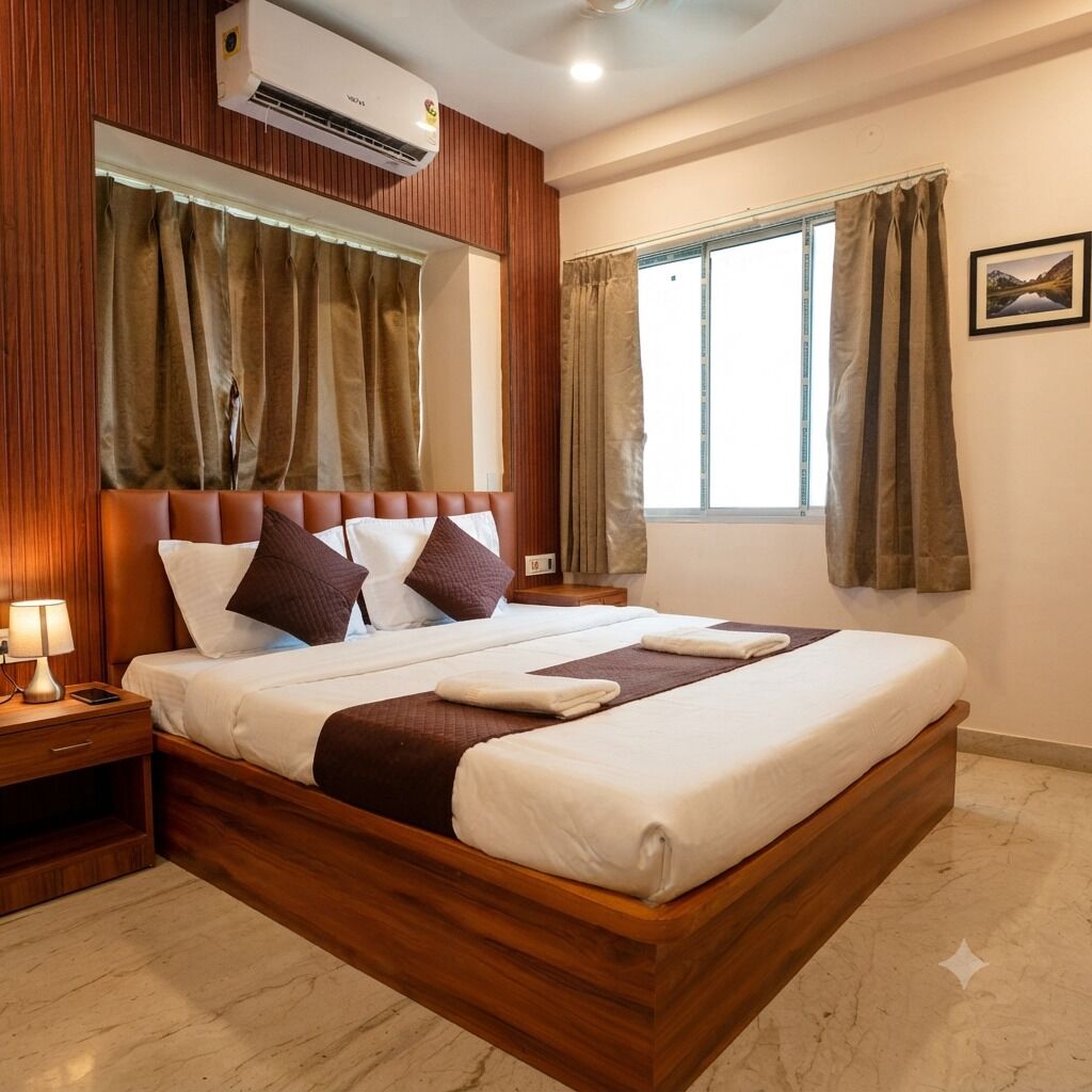A hotel room with a wooden bed, a nightstand, a wall-mounted air conditioner, and a window with curtains.