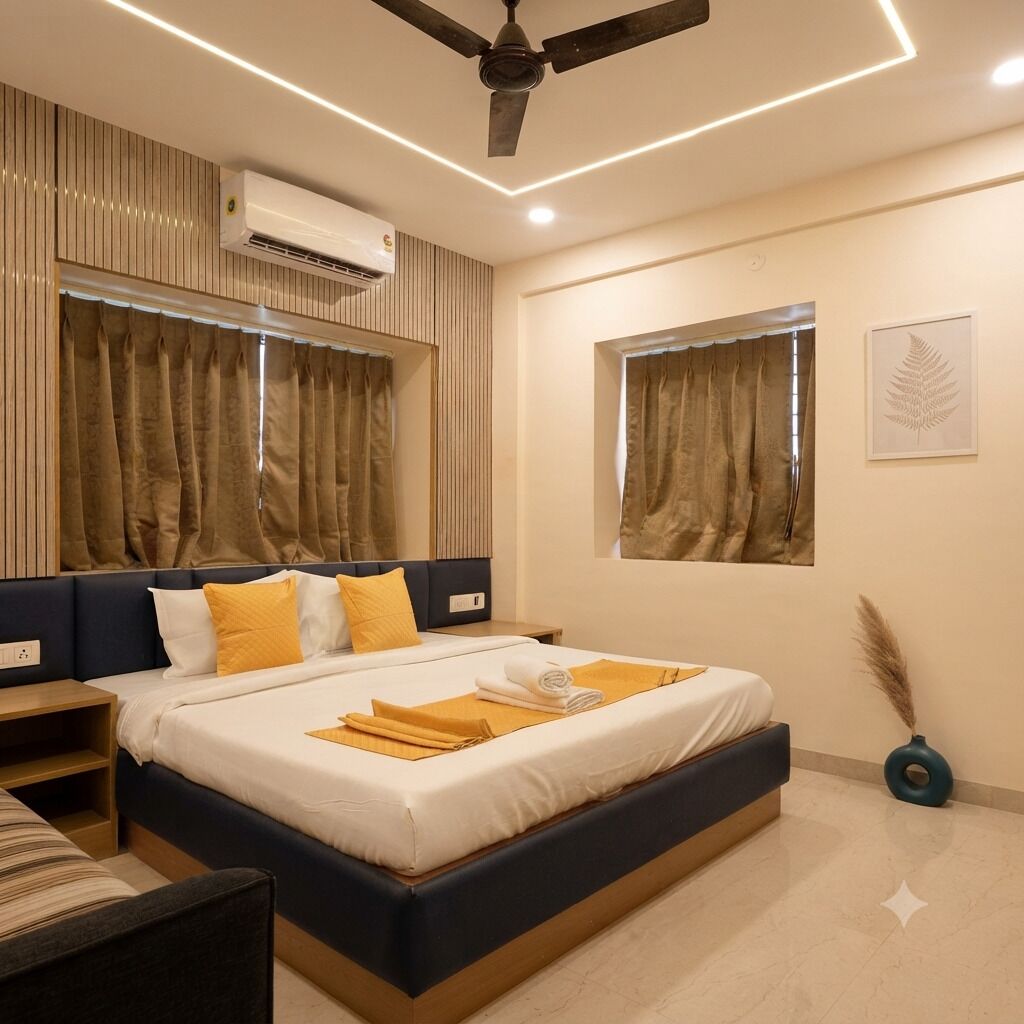 A modern hotel room with a bed, bedside tables, an air conditioning unit, a ceiling fan, and a window with curtains.