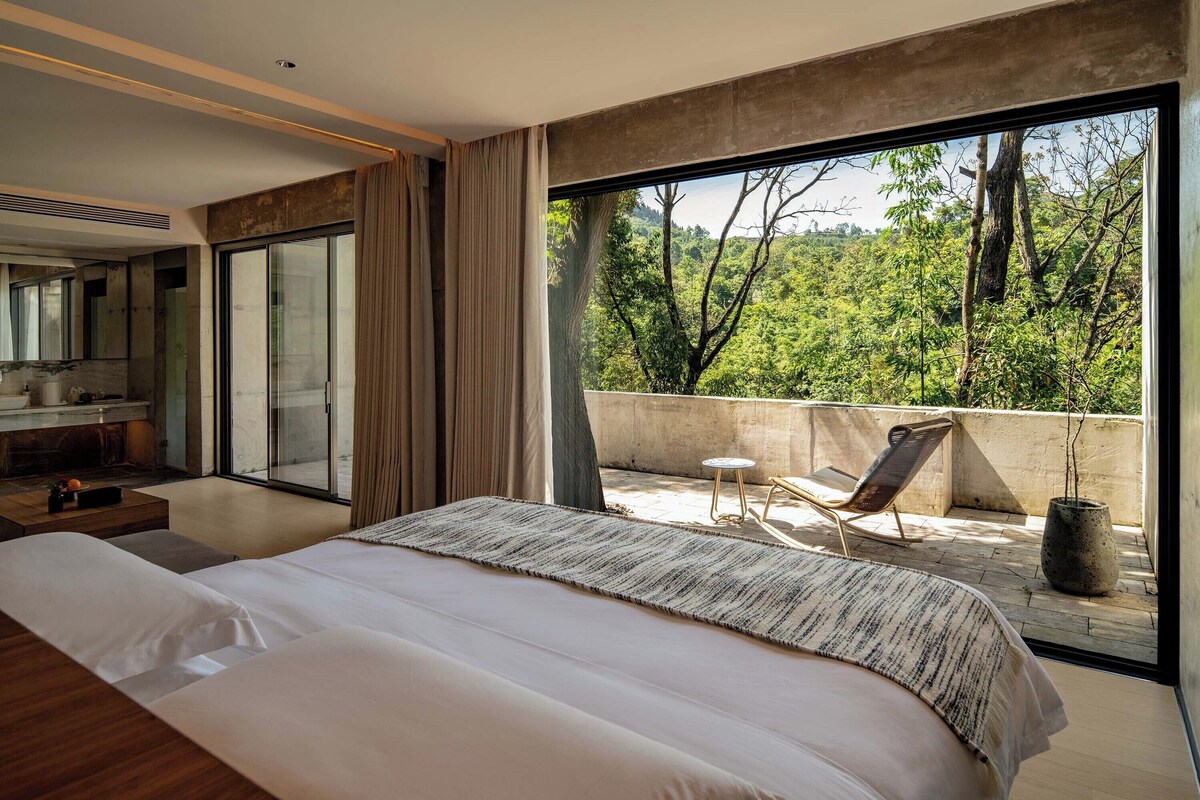 Premium bedding, desk, laptop workspace, blackout curtains
