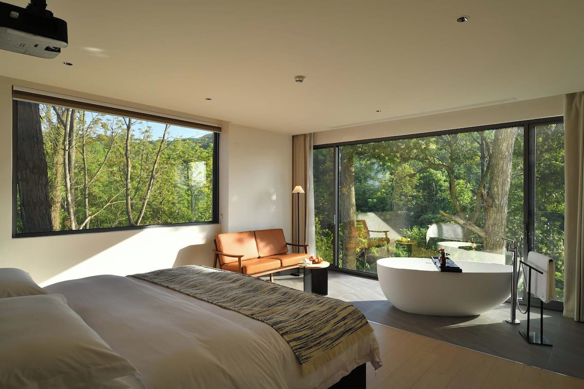 Premium bedding, desk, laptop workspace, blackout curtains